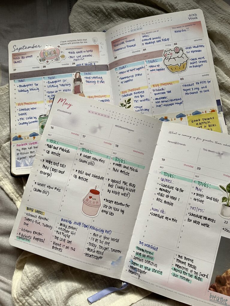 Two open planners on top of each other.