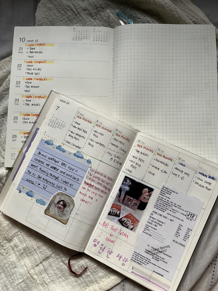 Two open planners on top of a white cloth.
