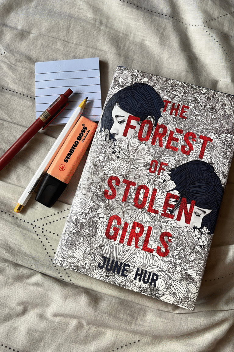a photo of a book with a memo pad, pens, and highlighter representing reconnecting with old hobbies